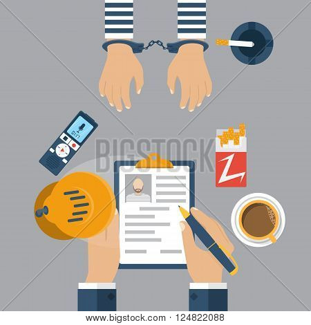 Police Detective Interrogating A Prisoner In Handcuffs