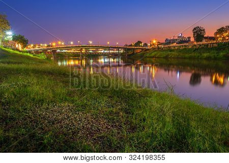 Beautiful White Grass Grass View The Nan River And The Bridge (eka Thot Sa Root Bridge) At Sunset In