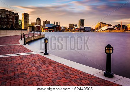 Long Exposure Of The Skyline And Waterfront Promenade In Baltimore, Maryland.