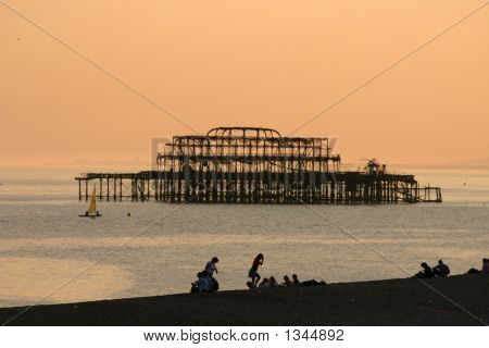 Orange sunset sky over pier