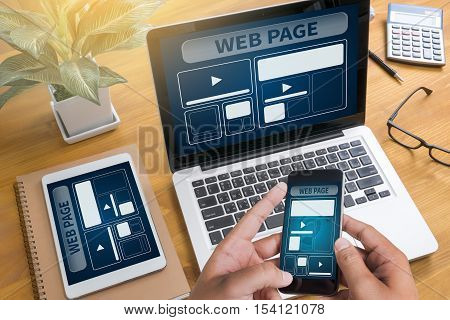 Web Design Template And  Web Page Closeup Shot Of Laptop With Digitaltablet And Smartphone On Desk.