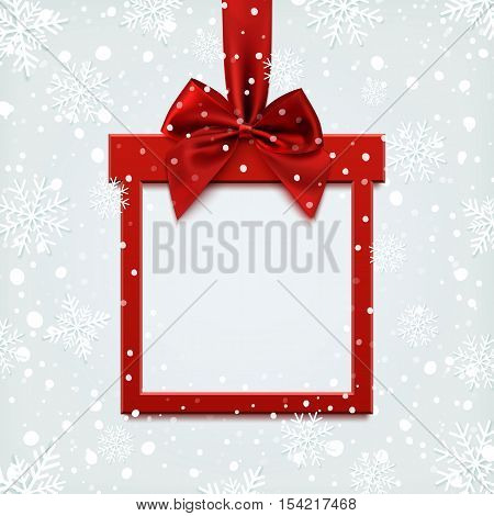 Blank red square banner in form of Christmas gift with red ribbon and bow, on winter background with snow and snowflakes. Brochure or banner template.