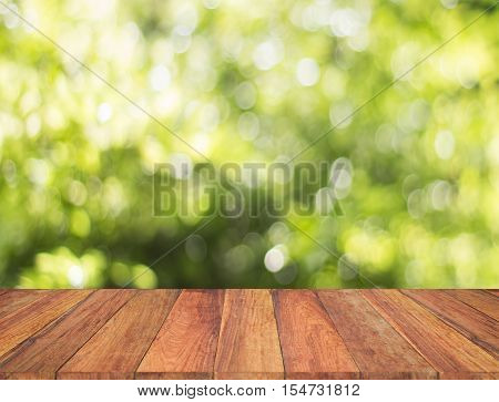 Wood Table With Blur Tree Background. Abstract Blur Background Wood Table For Display Your Product.