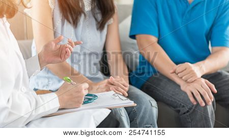 Patient Couple Consulting With Doctor Or Psychologist On Marriage Counseling, Family Medical Healthc