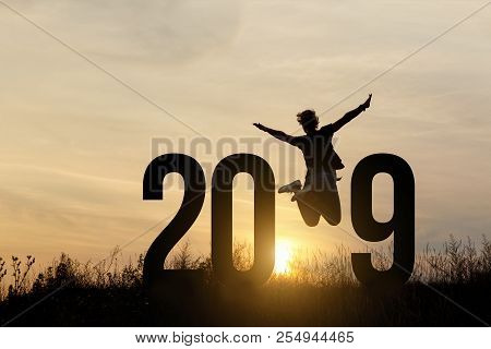 Freedom Silhouette Woman And 2019 .concept Of A New Year.