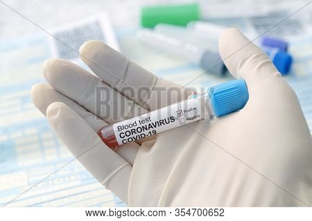 2019-ncov Coronavirus Originating In Wuhan, China. Coronavirus Blood Test Concept. Doctor Hand In Me