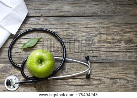 Alternative medicine stethoscope and green symbol  abstract