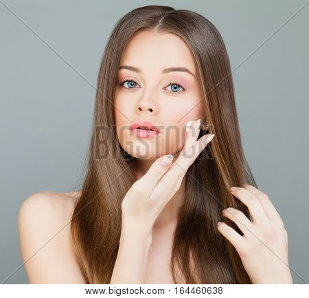 Young Woman Spa Model Applies a Moisturizer to her Face. Skincare Concept
woman, apply, cream, moisturizing, moisturizer, spa, face, healthy, model, care, skincare, health, brown, skin, long, hair, routine, wellbeing, purity, wellness, young, white, beaut