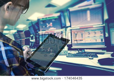 Double exposure of  women Engineer in hipster shirt  working with tablet in control room of oil and gas platform or plant industrial for monitor process, business and industry concept