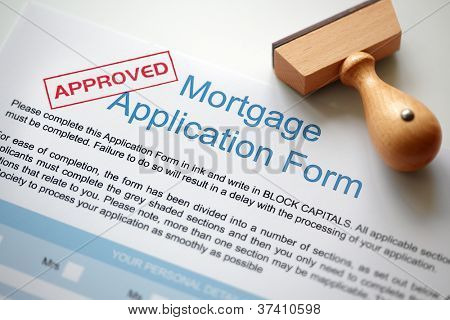 Approved Mortgage loan application with rubber stamp