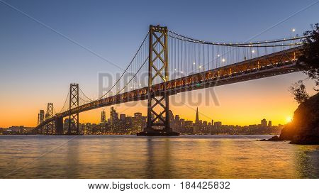 San Francisco Skyline With Oakland Bay Bridge At Sunset, California, Usa