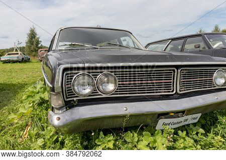 Mozhaisk, Russia - August 11, 2019: Old Abandoned Rusty Vehicles, Crushed Cars In Scrapyard, Junk Ya