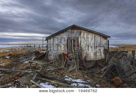 Old abandoned and derelict home on the prairie