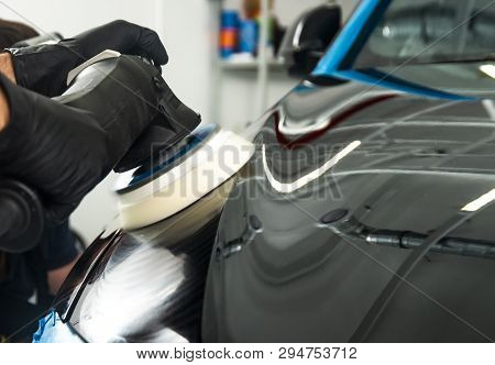 Car Polish Wax Worker Hands Applying Protective Tape Before Polishing. Buffing And Polishing Car. Ca