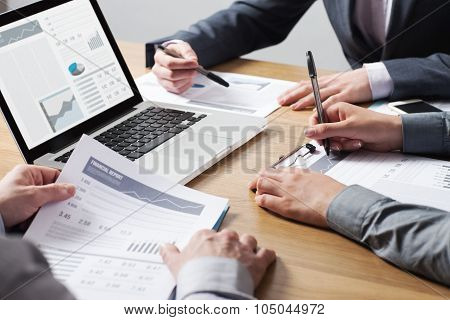 Business Professionals Analyzing Financial Data