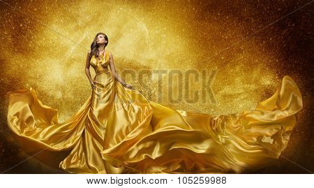 Gold Fashion Model Dress Woman In Golden Silk Gown Flowing Fabric Beautiful Girl on Stars Sky looking up