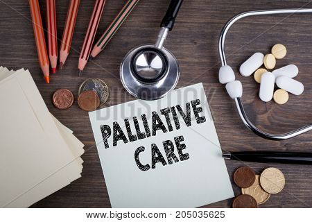 Palliative Care. Desk with stetascope, background for medical care.