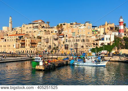 JAFFA, ISRAEL - JULY 21, 2015: Fishing boats and typical houses of old Jaffa - ancient port and famous tourist destination associated with biblical stories as well as mythological.