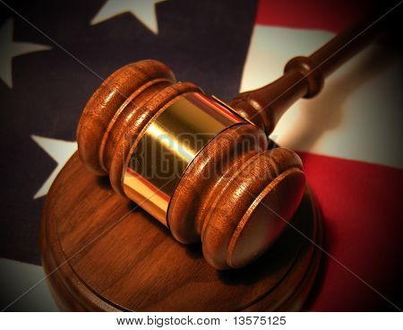 A photo of a gavel on the American flag