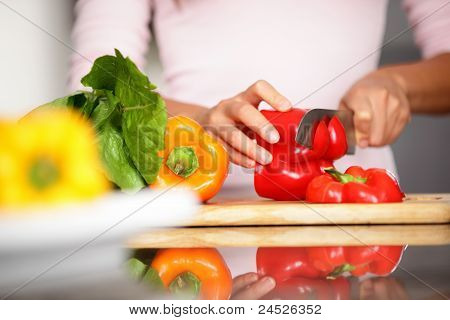 Peppers - Woman Cutting Red Pepper