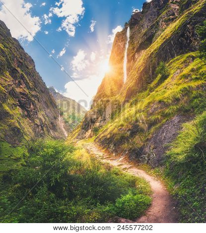 Himalayan Mountains Covered Green Grass, High Waterfall, Beautiful Path, Green Trees, Blue Sky With 