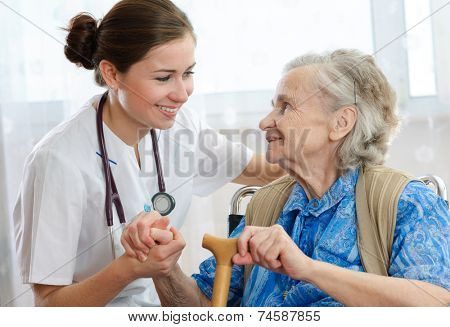 Senior woman with her home caregiver