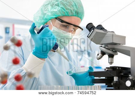 Scientist with dropper working  at the laboratory