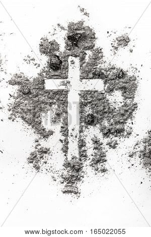 Christian cross made in ash dust as a religion ash wednesday concept background