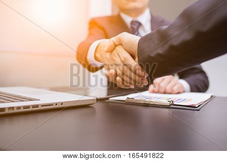 Business Man. Business handshake and business people. Business handshake. Business handshake and business people concept. Two business men shaking hands over sunny office background. business Partnership, Deal. business sunset.