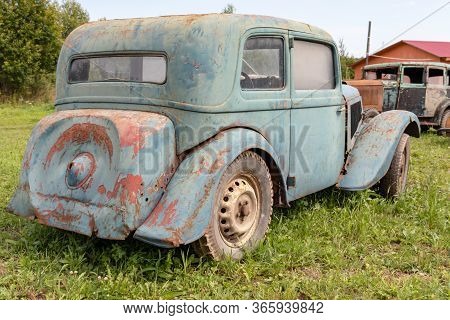 Mozhaisk, Russia - August 11, 2019: Old Abandoned Rusty Vehicles, Crushed Cars In Scrapyard, Junk Ya