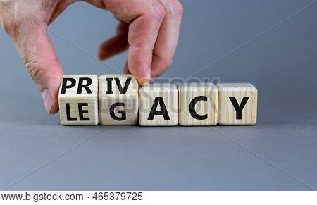 Privacy Or Legacy Symbol. Businessman Turns Wooden Cubes And Changes The Word Legacy To Privacy. Bea