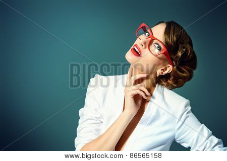 Close-up portrait of a gorgeous young woman wearing glasses. Beauty, fashion. Make-up. Optics, eyewear. 