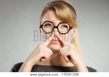 Girl Pinches Her Nose Because Of Stench Stink.