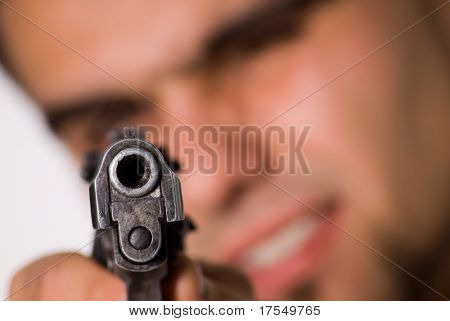 Man aiming at spectator with gun