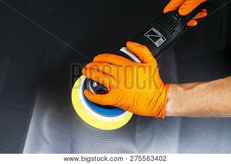 Car Polish Wax Worker Hands Applying Protective Tape Before Polishing. Buffing And Polishing Car. Ca