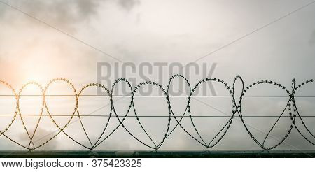 Prison Security Fence. Barbed Wire Security Fence. Razor Wire Jail Fence. Barrier Border. Boundary S