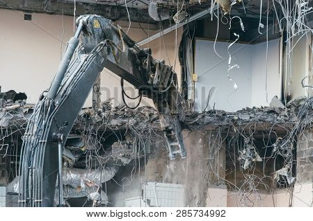 Close Up Photo Of Building Demolition Excavator/destruction Of A Building, House Ruins, Reconstructi