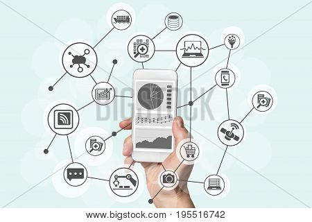 Predictive analytics and big data concept with hand holding modern smart phone to analyze data from marketing, shopping, cloud computing and mobile devices