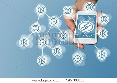 Blockchain and bitcoin concept with hand holding modern smart phone as example for fin tech technology