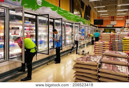 BANGKOK THAILAND - JULY 28: A number of unidentified employees check store inventories while being supervised by the manager in BigC Extra Supermarket on July 28 2017 in Bangkok.