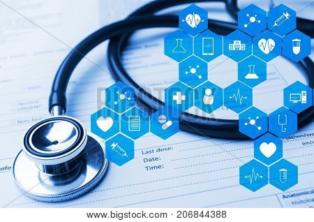 stethoscope and medical information form on desk with medical icon in hexagon pattern blue color tone laboratory science chemical and medical research conceptstethoscope and medical information form on desk with medical icon in hexagon pattern blue color