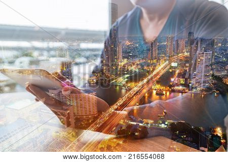 Double Exposure Of Man Or Male Hold Digital Wireless Tablet With City Building