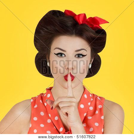 Pin-up Style Girl With Finger On Lips