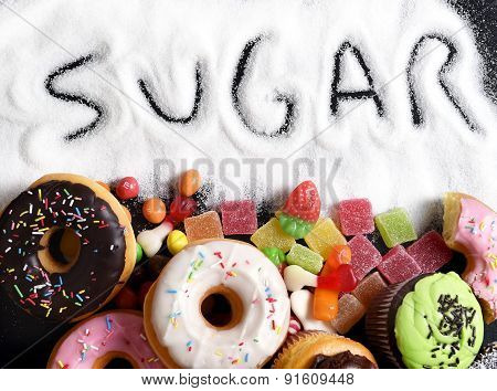 Mix Of Sweet Cakes, Donuts And Candy With Sugar Spread And Written Text In Unhealthy Nutrition