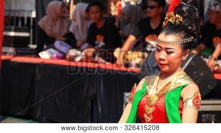 A Group Of Dancers While Performing On The Street Stage, Dancing To Traditional Javanese Dance, Peka