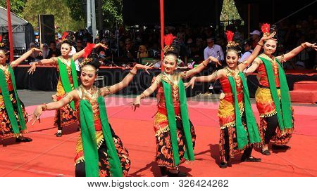 A Group Of Dancers While Performing On The Street Stage, Dancing To Traditional Javanese Dance, Peka