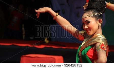 A Group Of Dancers While Performing On The Street Stage, Dancing To Traditional Javanese Dance, Peka