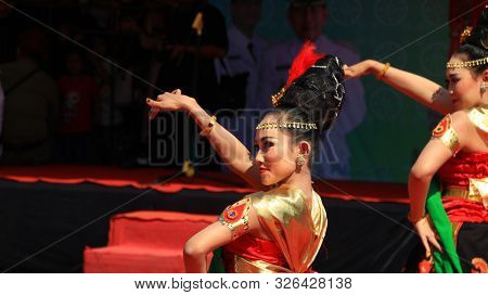 A Group Of Dancers While Performing On The Street Stage, Dancing To Traditional Javanese Dance, Peka