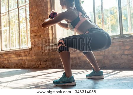 Young Fit Sporty Active Athlete Woman Wear Sportswear Crouching Doing Squats Session Fitness Trainin