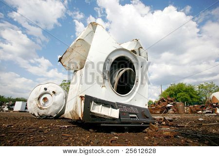 Old household appliances disposed of in metal scrapyard